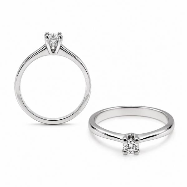 14 karátos fehér arany brill gyűrű. Tisztasága és színe a nemzetközi besorolás szerint: vs,g, nagysága 0,18ct.
